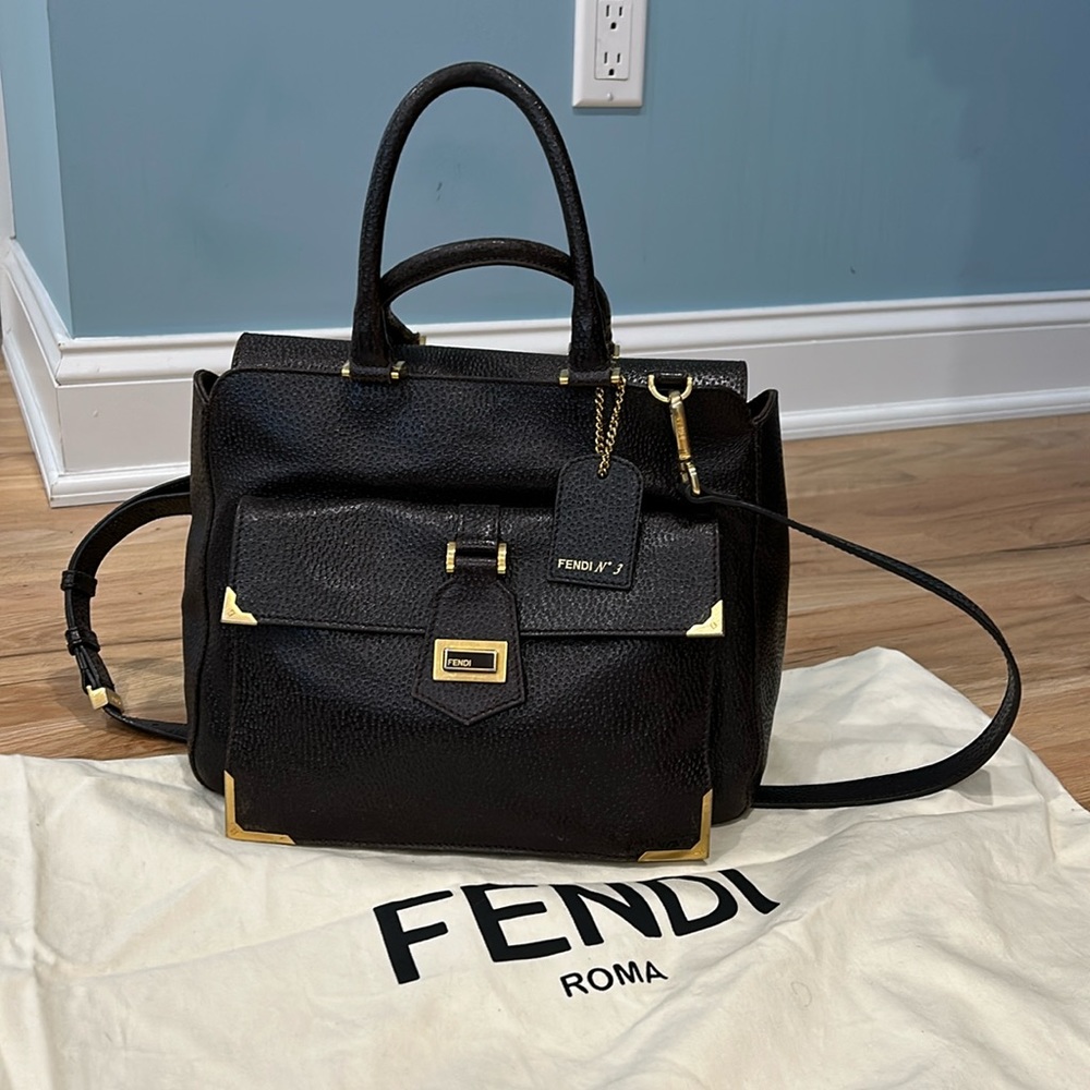 Fendi dark brown leather handbag with crossbody strap.